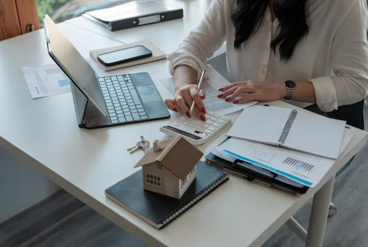 Woman calculating mortgage costs